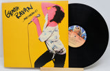 Front cover and vinyl record of Genya Ravan’s ...And I Mean It! album, featuring a striking vocal performance illustration