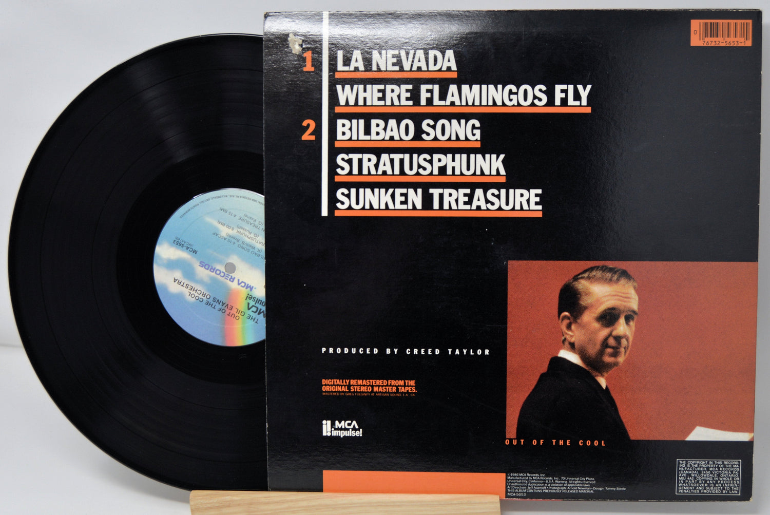 Back cover of Gil Evans Orchestra Out of the Cool vinyl LP featuring tracklist and photo of Gil Evans