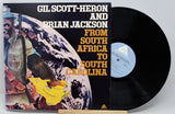 Vinyl record with cover featuring 'Gil Scott-Heron and Brian Jackson' on a white background