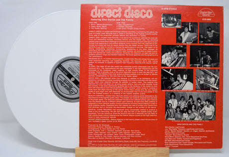 Vinyl record 'Gino Dentie And The Family Direct Disco' with a red label featuring text and black and white photos on a white background