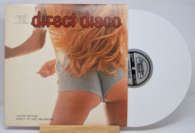 Vinyl record with a cover featuring a person with red hair and the text 'direct disco'.