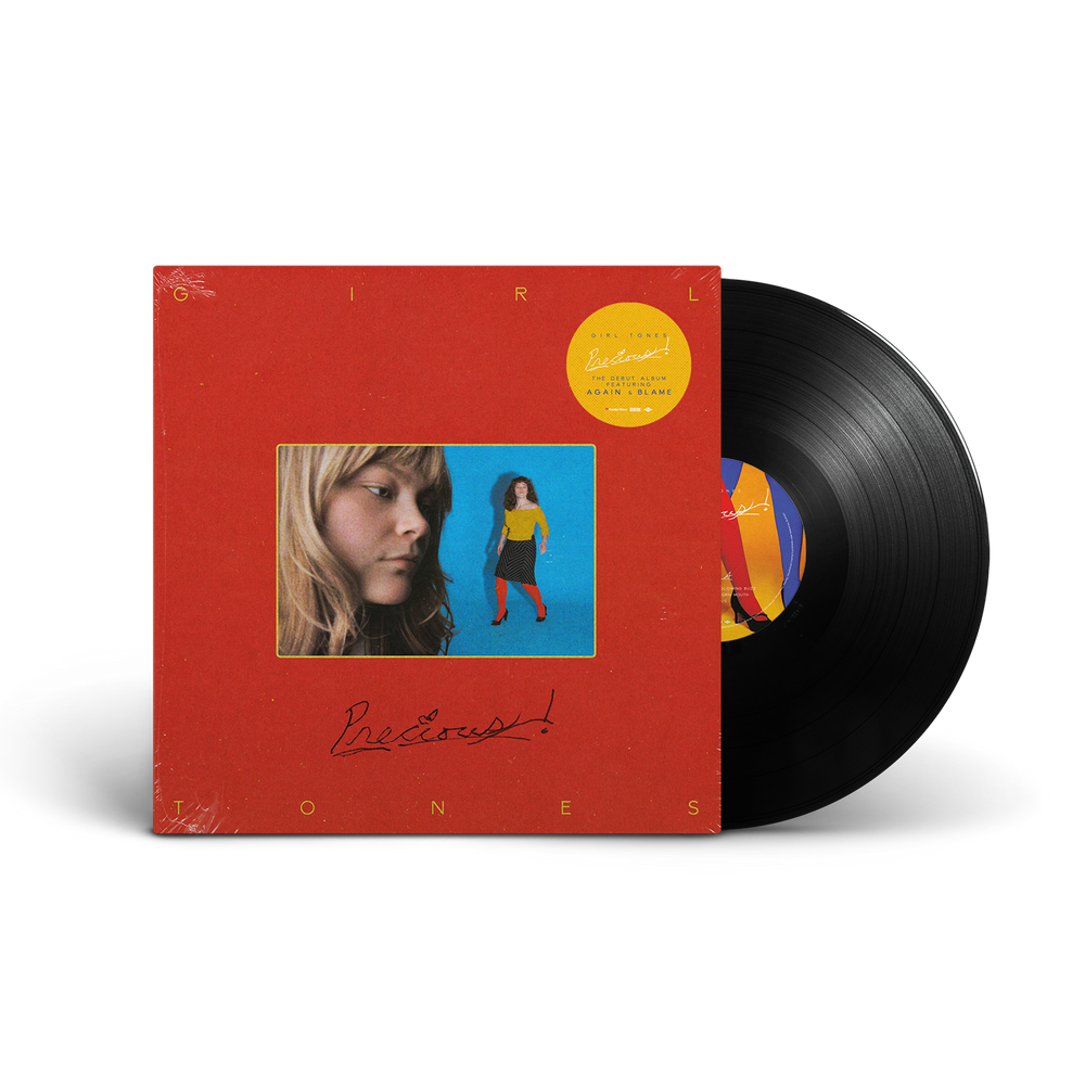 A vinyl record package shown on a white background, featuring a red square album cover with a central portrait photo and a partially visible black vinyl record behind it.