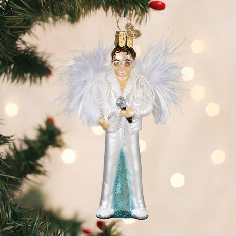 Glam rock singer ornament hanging on a Christmas tree with festive lights