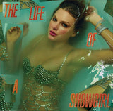Close-up of The Life of a Showgirl album cover featuring glamorous woman in jeweled attire.