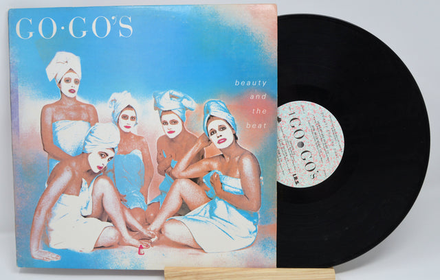 Vinyl record with cover featuring 'GO-Go's' and album art of women in towels.