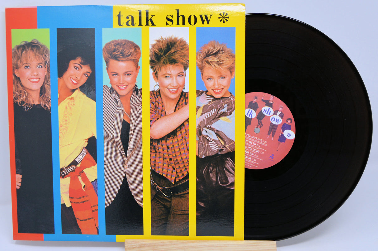 Vinyl record with a colorful cover featuring the band and the text 'talk show'.