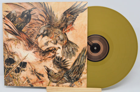 Gold vinyl record with crow-themed illustrated album cover art