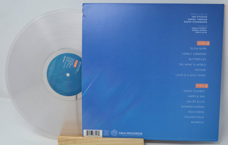 Golden Hour clear vinyl record partially inside blue back cover with tracklist