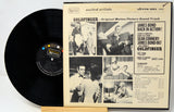 Vinyl record with 'Goldfinger' soundtrack cover featuring black and white images and text.