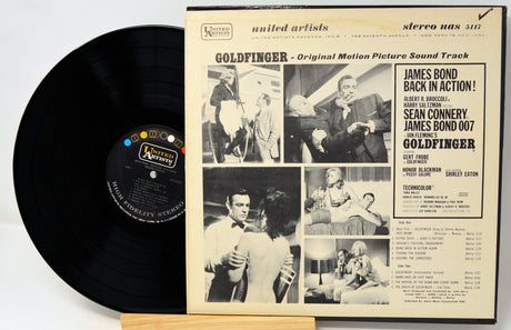 Vinyl record with 'Goldfinger' soundtrack cover featuring black and white images and text.