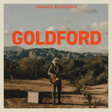 Album cover with a person playing guitar in a scenic landscape, featuring the text 'Orange Blossoms Goldford'.