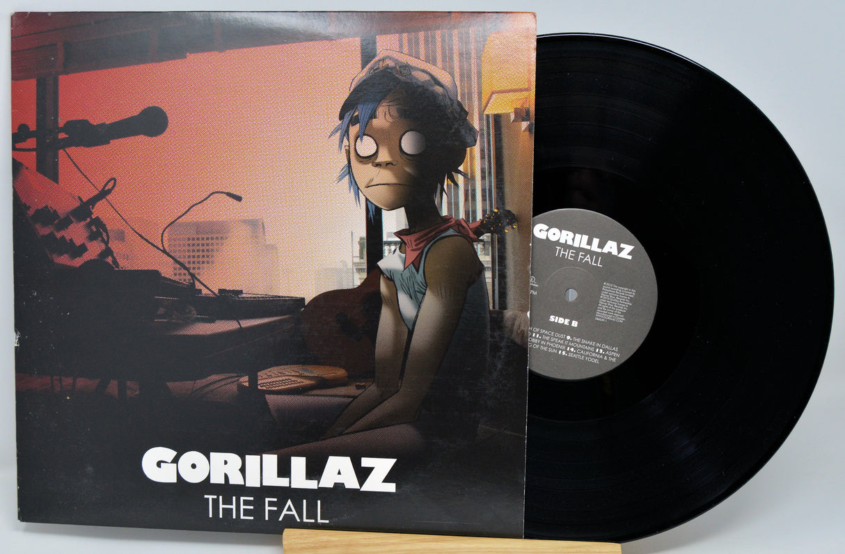 Vinyl record and cover for Gorillaz' 'The Fall' on a light gray background