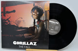 Vinyl record and cover for Gorillaz' 'The Fall' on a light gray background