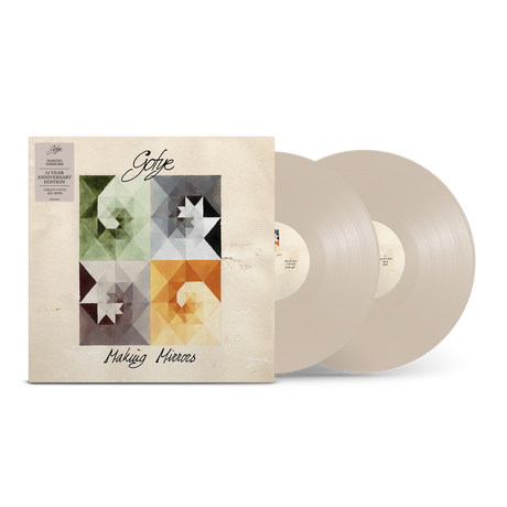 A vinyl record album shown with its illustrated outer sleeve and two translucent pale pink records partially visible behind it on a white background.