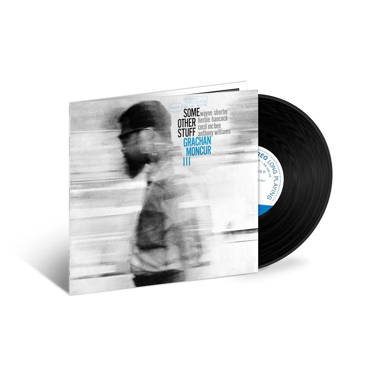 Vinyl record with a blurred cover featuring a person and album details.