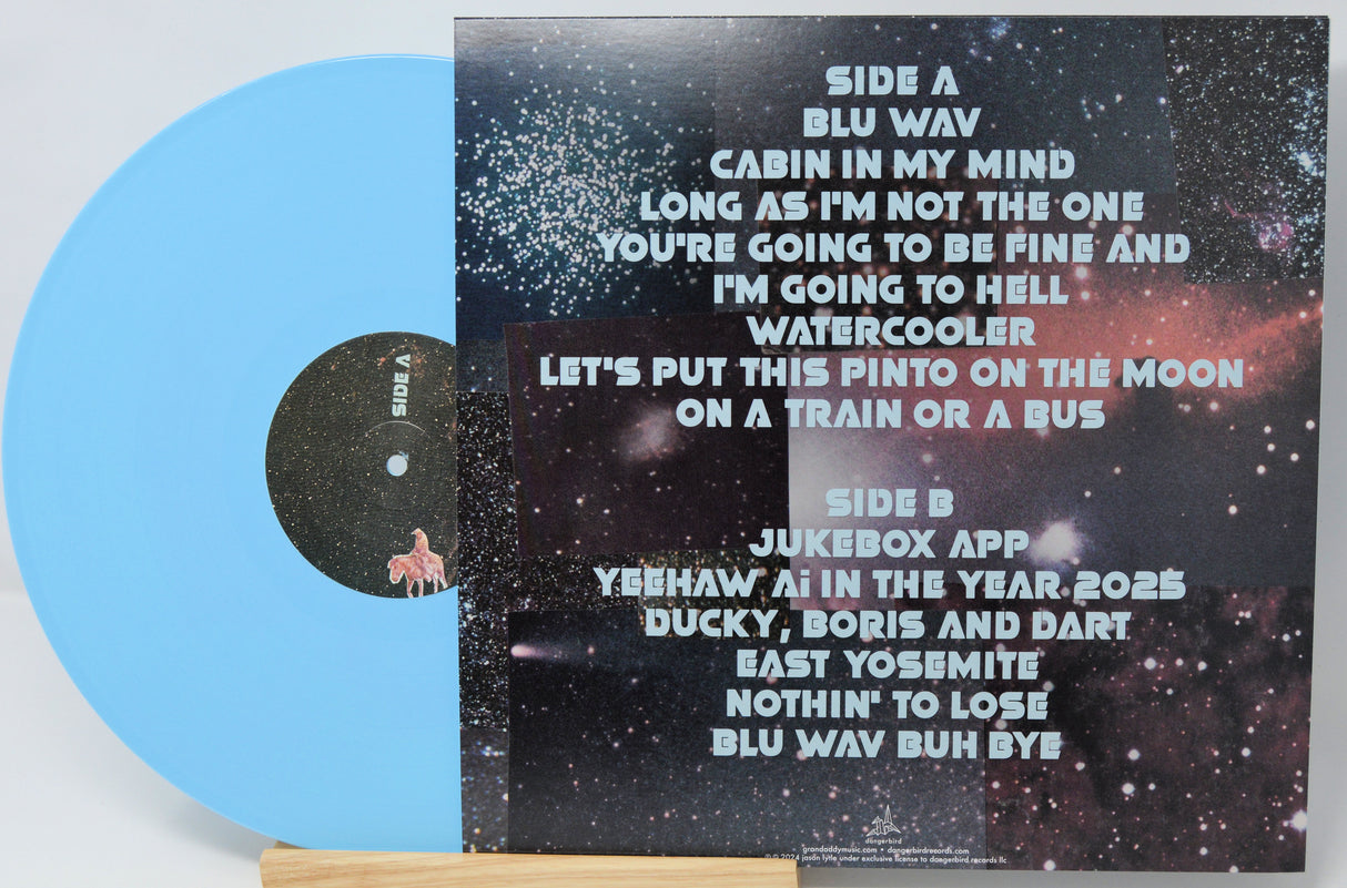 Vinyl record with a space-themed cover and blue label