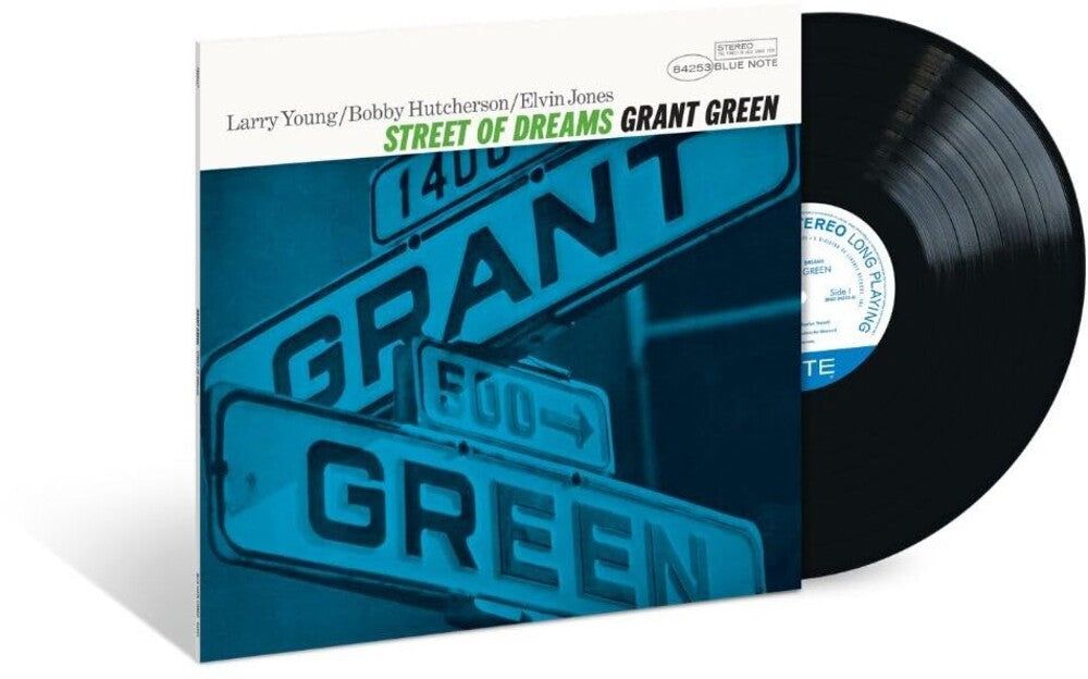Grant Green's 'Street of Dreams' vinyl record album, showing the illustrated sleeve with stacked street signs in blue-green tones and a partially visible black vinyl record behind it.