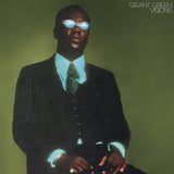 A vinyl record cover featuring a portrait of Grant Green with a green tinted background and the text 'GRANT GREEN VISIONS'.