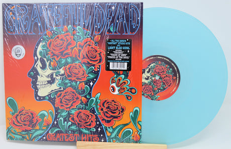 Vinyl record with colorful design featuring a skull and roses, on an orange and blue background.