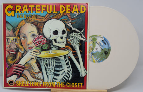 Vinyl record with cover featuring 'Grateful Dead' and skeleton design on a white background