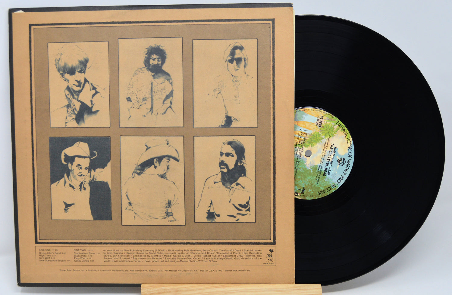 Vinyl record with a cover featuring portraits of a person on a beige background