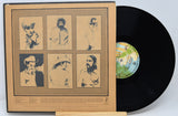 Vinyl record with a cover featuring portraits of a person on a beige background