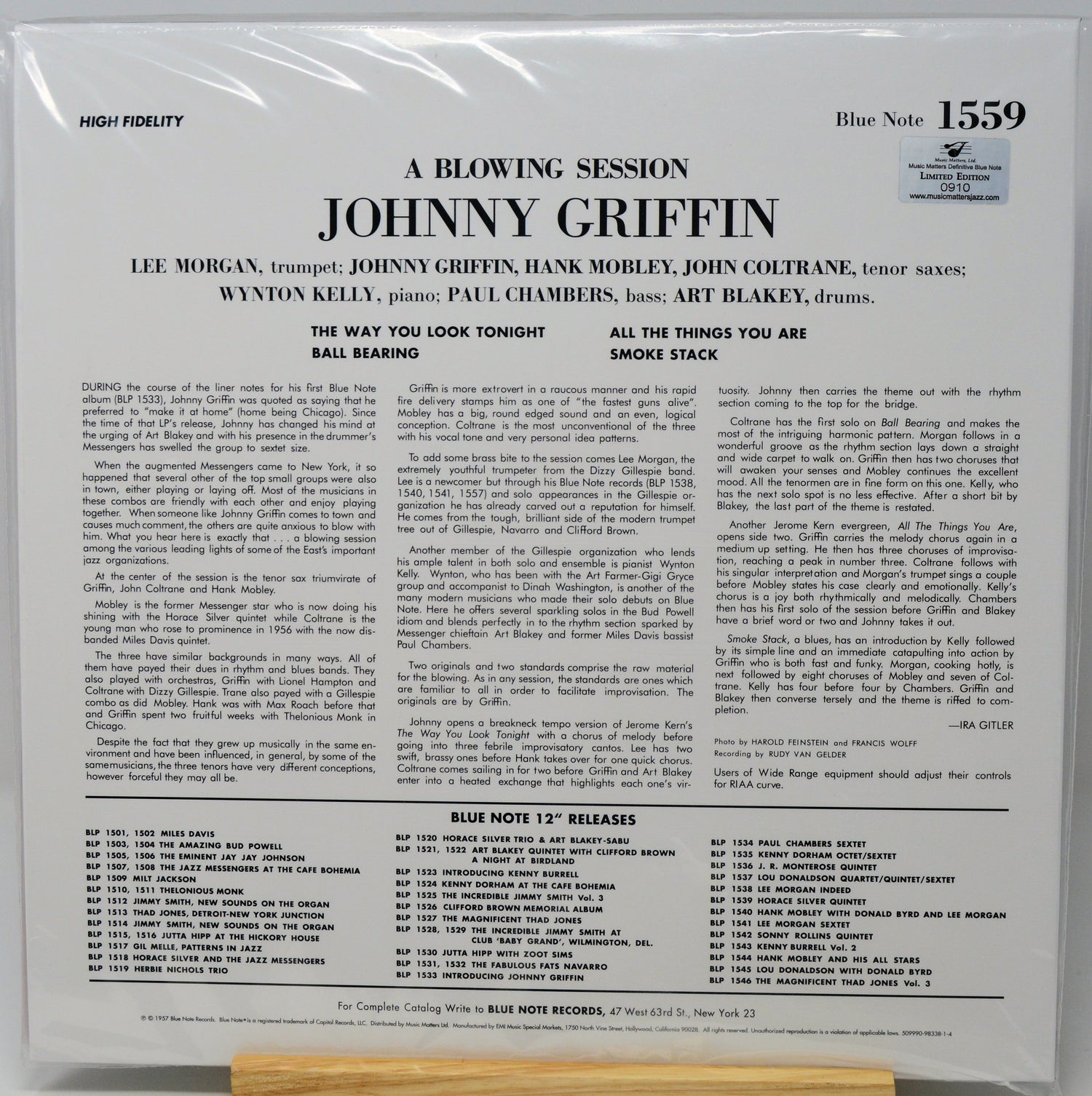 Back cover of a vinyl record sleeve for 'A Blowing Session: Johnny Griffin' on Blue Note, photographed flat against a white background with a small wooden stand visible at the bottom.