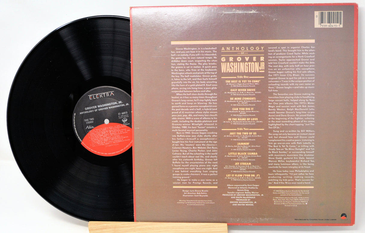 Vinyl record with cover displaying text on a white background