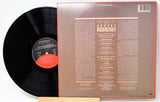 Vinyl record with cover displaying text on a white background