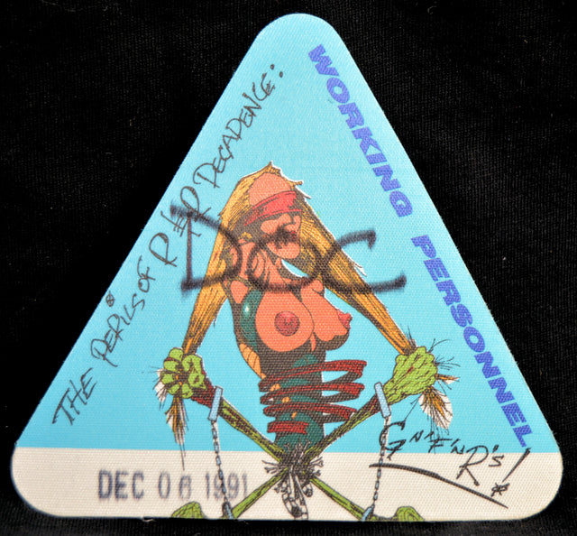 Triangular Guns N Roses backstage concert pass with cartoon topless woman and text on a blue background