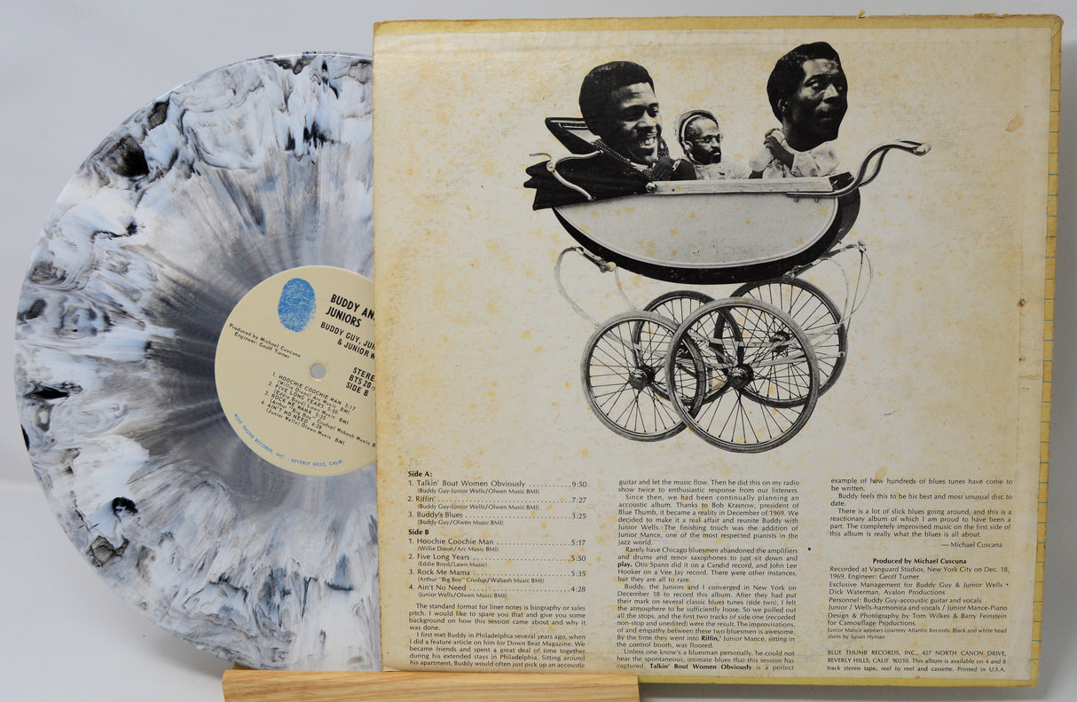 Vinyl record with a baby carriage illustration on its cover