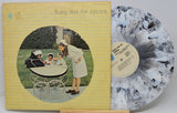 Vinyl record with cover featuring a woman and children around a baby carriage, on a yellow background.