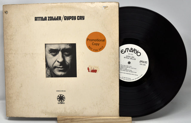 Front cover and vinyl record of Attila Zoller's Gypsy Cry LP promotional copy, with artist portrait