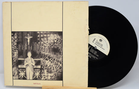 Vinyl record with cover featuring a black and white illustration of a person in a room.