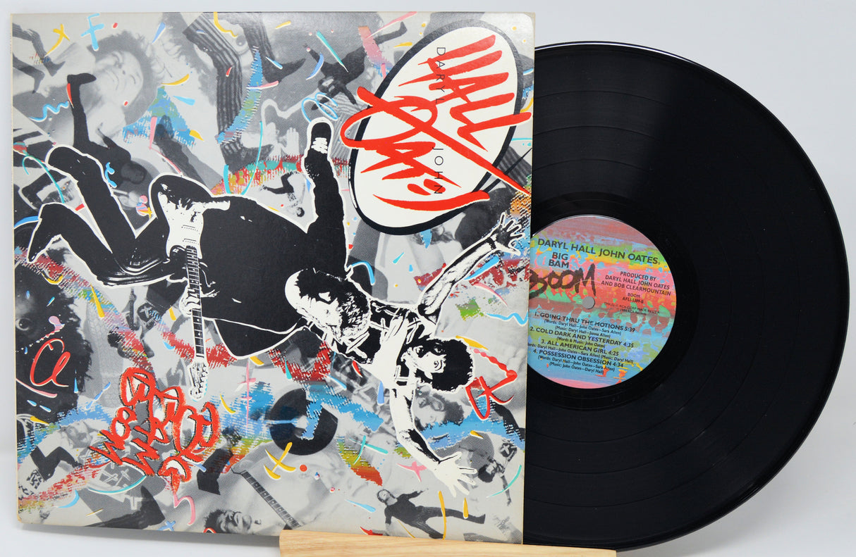 Vinyl record with a colorful cover featuring artistic design and a visible record label.