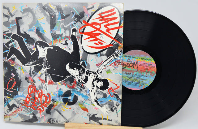 Vinyl record with a colorful cover featuring artistic design and a visible record label.