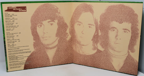 An open vinyl record sleeve or booklet showing three sepia-toned portraits of Frank Sinatra on the right page and a tracklist on the left page, photographed against a light neutral background.