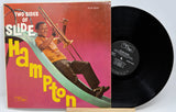 Vinyl record with a colorful cover featuring a person playing a trombone, on a white background.