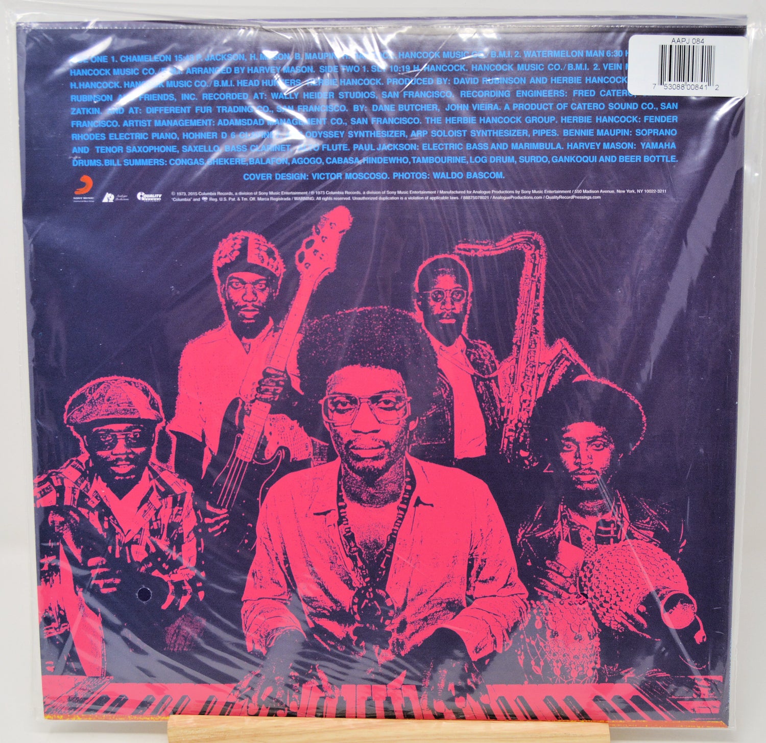 Vinyl record album cover for 'The Godfather Jazz Collection' on a wooden display stand, wrapped in protective plastic with a barcode sticker in the top right corner.