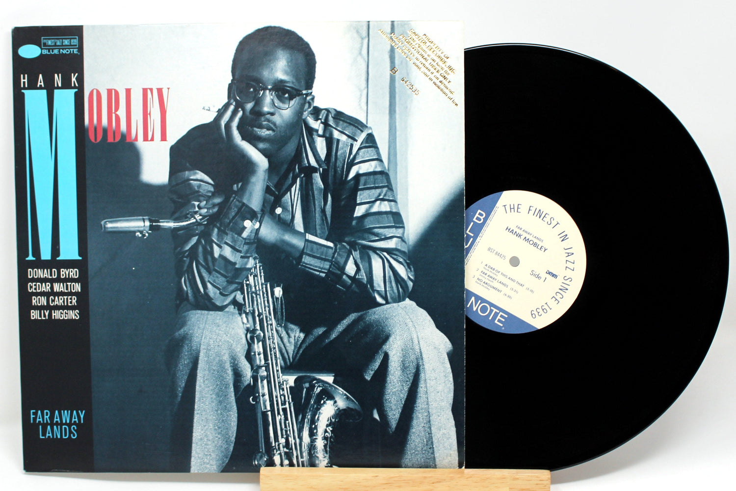 Front cover of Hank Mobley's 'Far Away Lands' Blue Note LP with vinyl record and saxophonist portrait