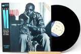 Front cover of Hank Mobley's 'Far Away Lands' Blue Note LP with vinyl record and saxophonist portrait