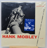 A vintage Blue Note 156LP vinyl record sleeve for Hank Mobley, featuring a black-and-white photo of a saxophonist with a blue label insert and red 'HANK MOBLEY' text on a cream background.