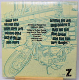 Album cover with motorcycle illustration and text on a yellowed paper background