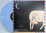 Back cover of Khruangbin's Hasta El Cielo LP with cosmic artwork, song list, crescent moon, and illustrated cow