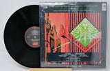 Back cover of Hawkwind's 'The Xenon Codex' vinyl LP with futuristic city and tracklist