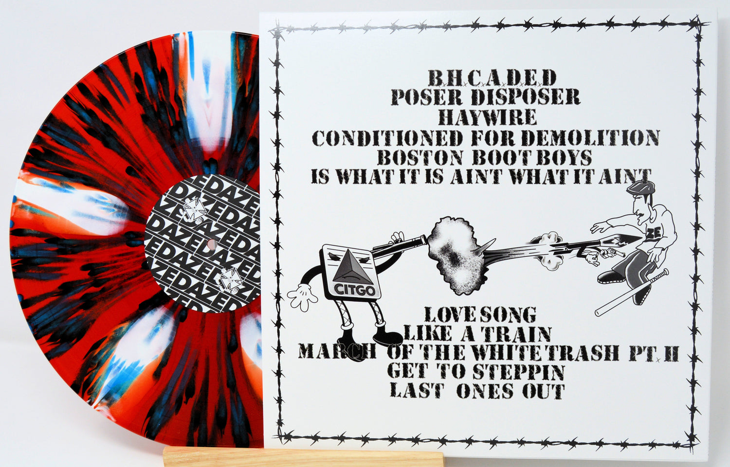 Haywire Conditioned for Demolition LP back cover and red, black, and blue splatter vinyl record