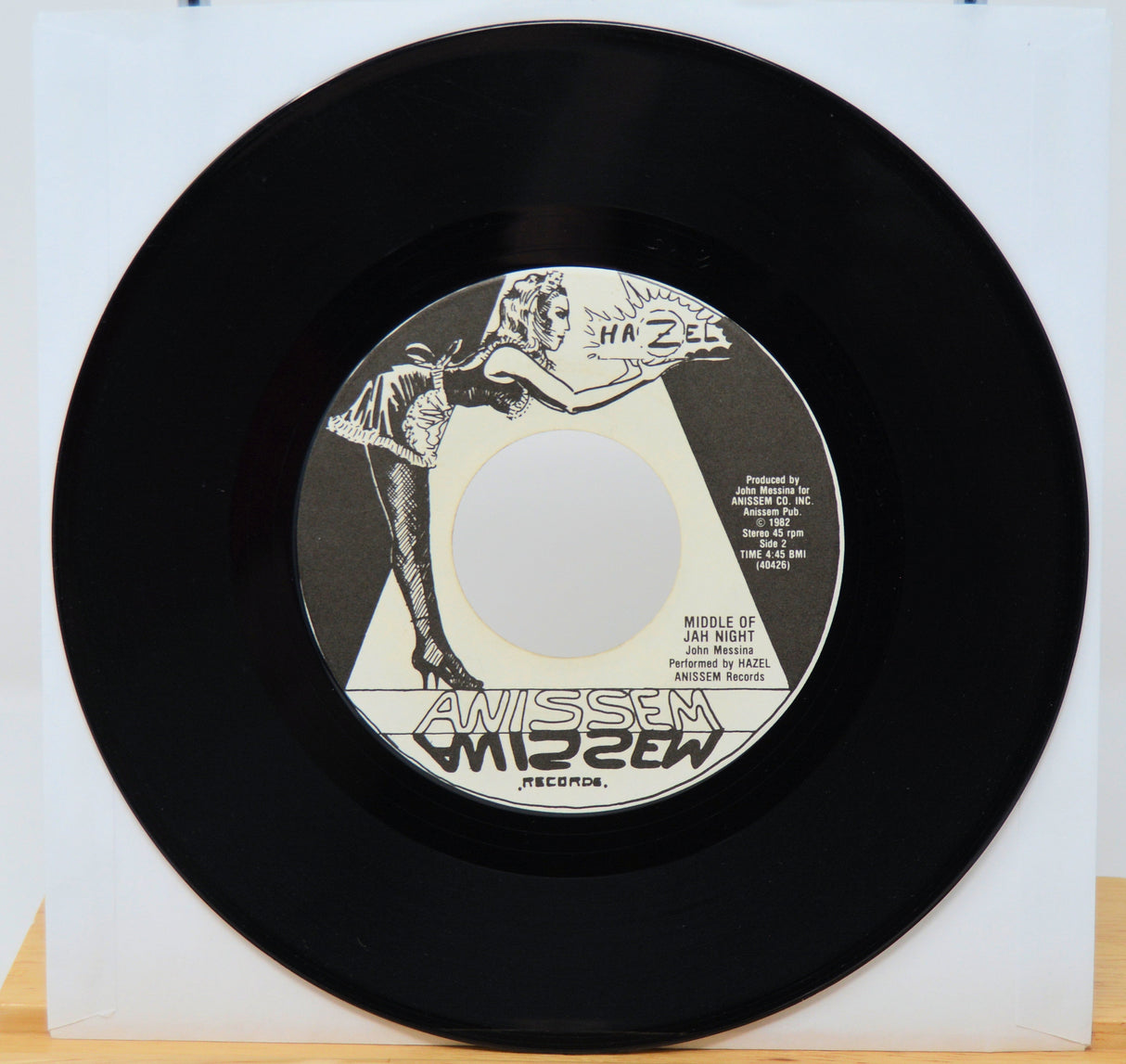 Vinyl record with a red cover featuring a face design and 'Opeth' logo.
