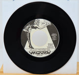 Vinyl record with a red cover featuring a face design and 'Opeth' logo.