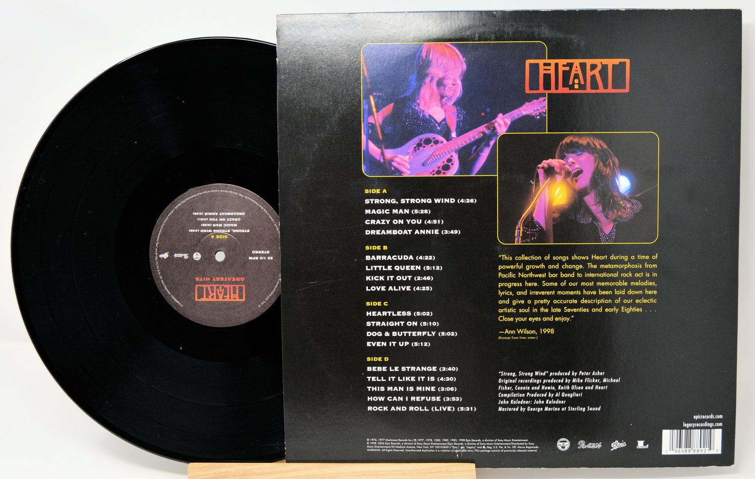 Vinyl record with cover featuring a musician and tracklist on a white background