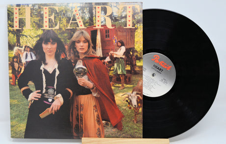 Vinyl record with cover featuring two people in vintage attire on a white background
